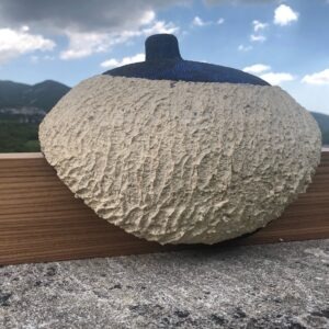 contemporary sculpture in blue ceramic on oak support by christiane filliatreau in stoneware